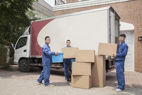 Person organizing boxes in a Tootingbec storage space