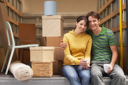 Professional moving team handling boxes in Tootingbec