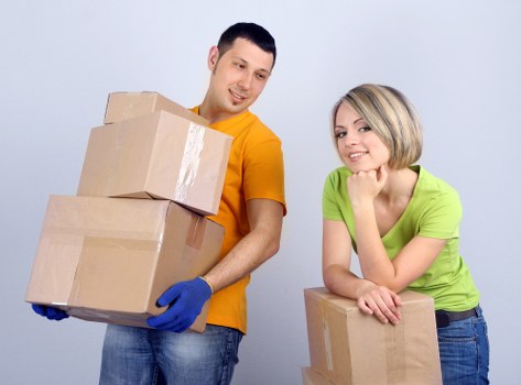 Packed moving boxes labeled for a flat removal in Tootingbec