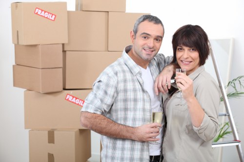 Professional movers handling furniture during a Tootingbec house move